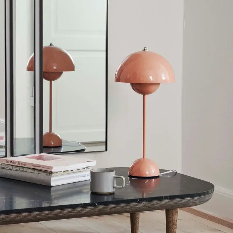 A sleek blush-pink iron mushroom shape table lamp with glossy finish and slender stem for modern decorbites iron mushroom decor