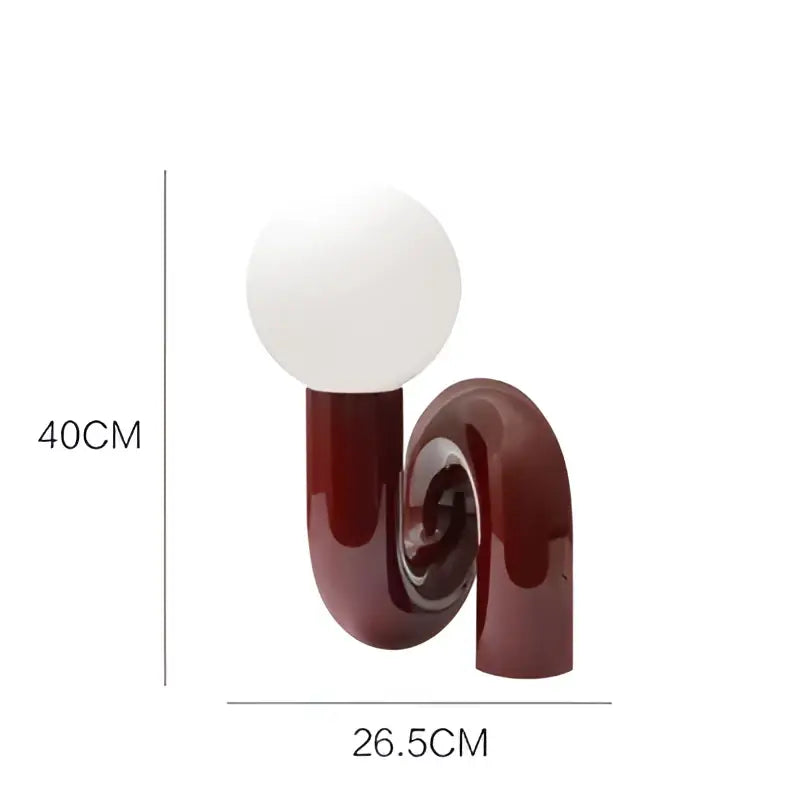 A sleek burgundy u-shaped table lamp with a white glass ball bulb for modern decorbites glass ball table decor