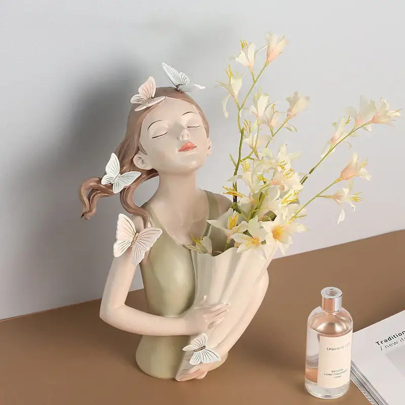 Delicate beige butterfly girl resin sculpture with white butterfly decorations holding pale yellow flowers for decorbites decor