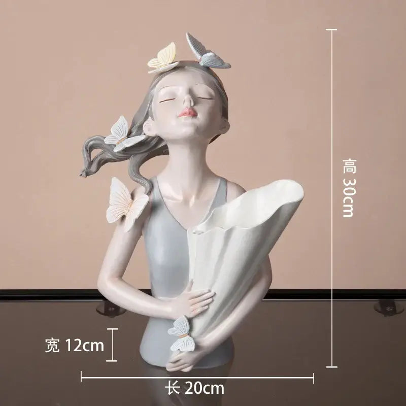 Modern butterfly girl resin sculpture in light gray with flowing hair and white butterflies for living room decorbites decor