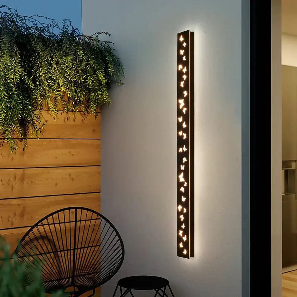 Modern black metal wall sconce with decorbites butterfly pattern led warm lights for outdoor yard lighting