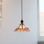 Modern butterfly pink led pendant lamp featuring a delicate stained glass butterfly design with brass finish and black cord decorbites butterfly pink decor