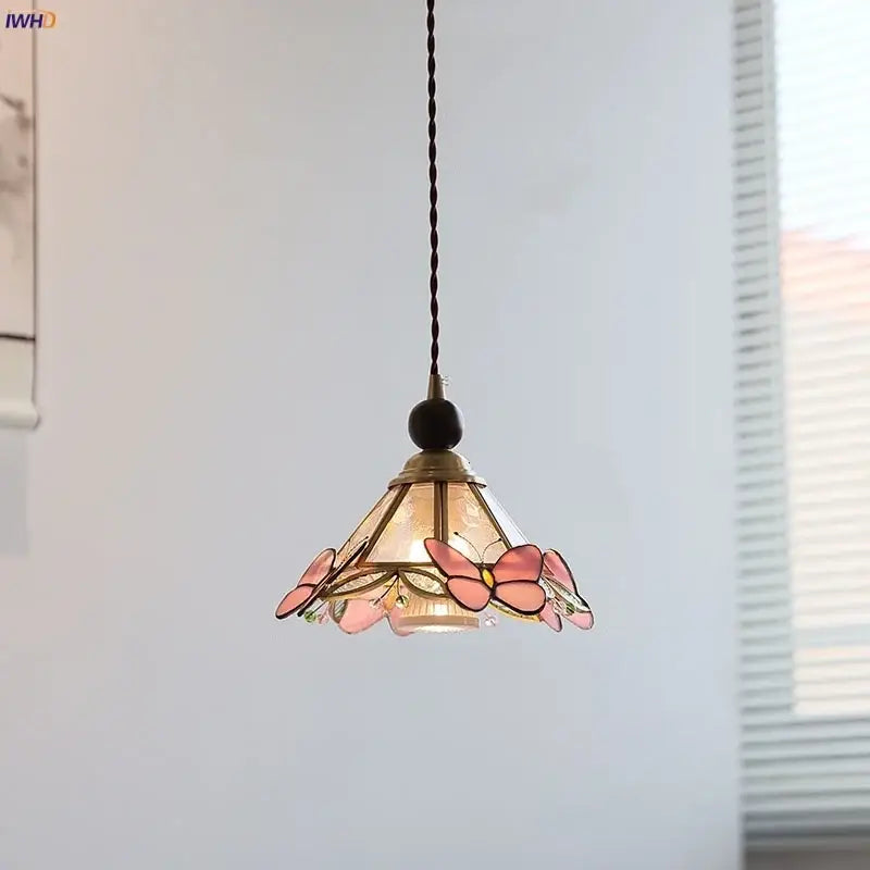 Modern butterfly pink led pendant lamp featuring a delicate stained glass butterfly design with brass finish and black cord decorbites butterfly pink decor