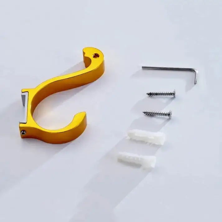 Gold-colored metal wall hook with sleek curved design and silver accent in decorbites candy color aluminum finish
