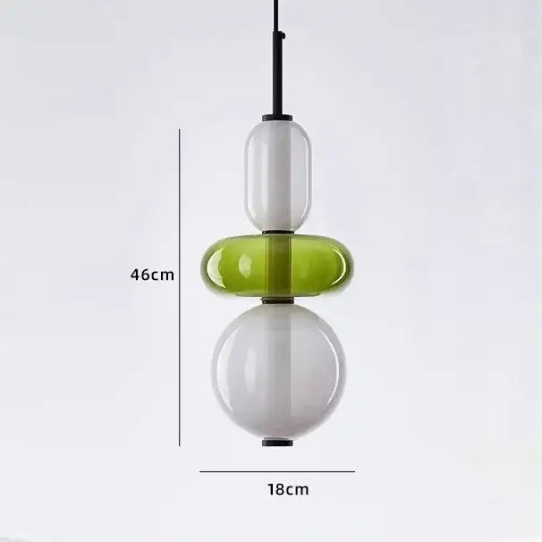 Modern candy glass ceiling chandelier with three stacked translucent white and lime green glass orbs suspended by black rod