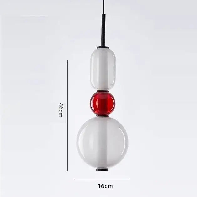 Modern candy glass ceiling hanging chandelier with stacked translucent white and red orbs suspended by black cord