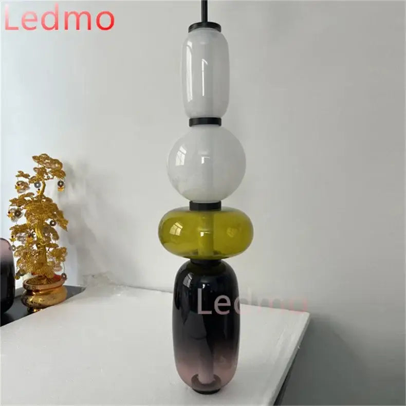 Modern candy glass ceiling pendant light with stacked white olive green and dark purple translucent spheres decorbites candy glass