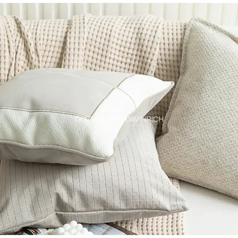 A soft light gray modern cappuccino tone geometry embroidery pillow with subtle quilted texture and white edge stitching
