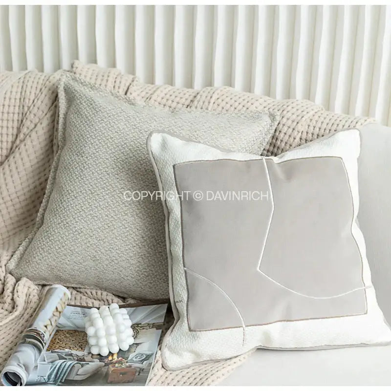 Modern gray and white accent pillow with textured fabric and cappuccino tone geometry embroidery for living room decorbites decor