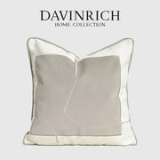 A modern cappuccino tone geometry embroidery pillow from decorbites featuring light gray and off-white fabric panels