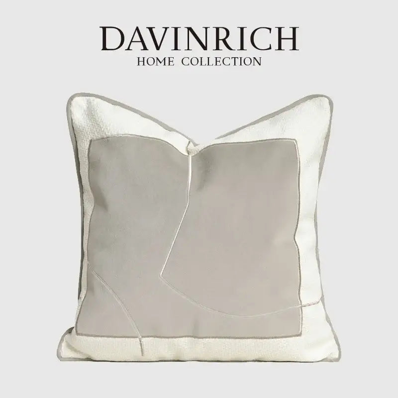 A modern cappuccino tone geometry embroidery pillow from decorbites featuring light gray and off-white fabric panels