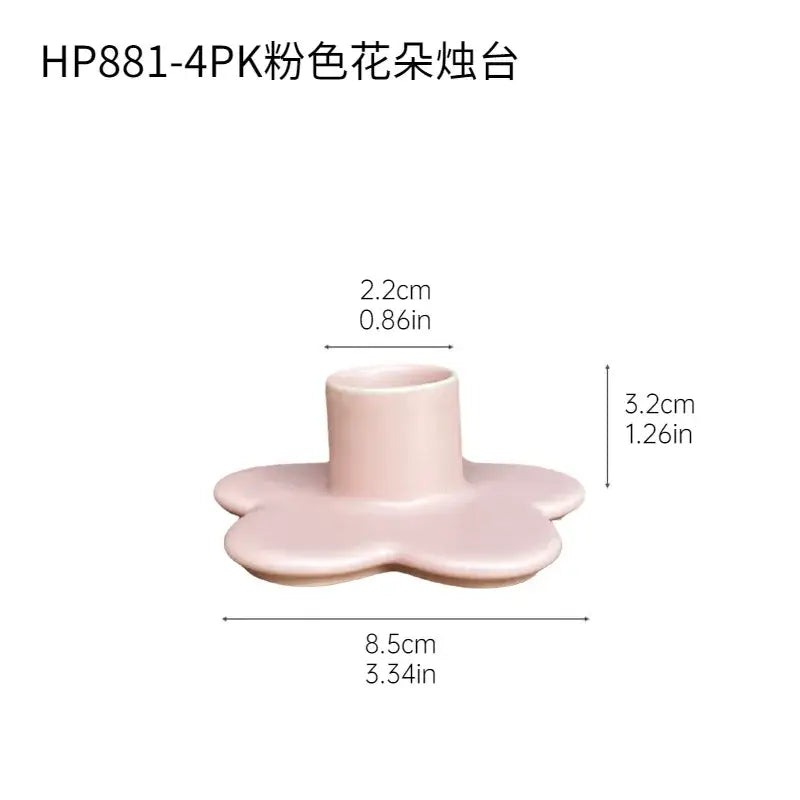 A delicate pink ceramic cartoon flower candle holder with rounded edges and central well for bedroom decorbites decor