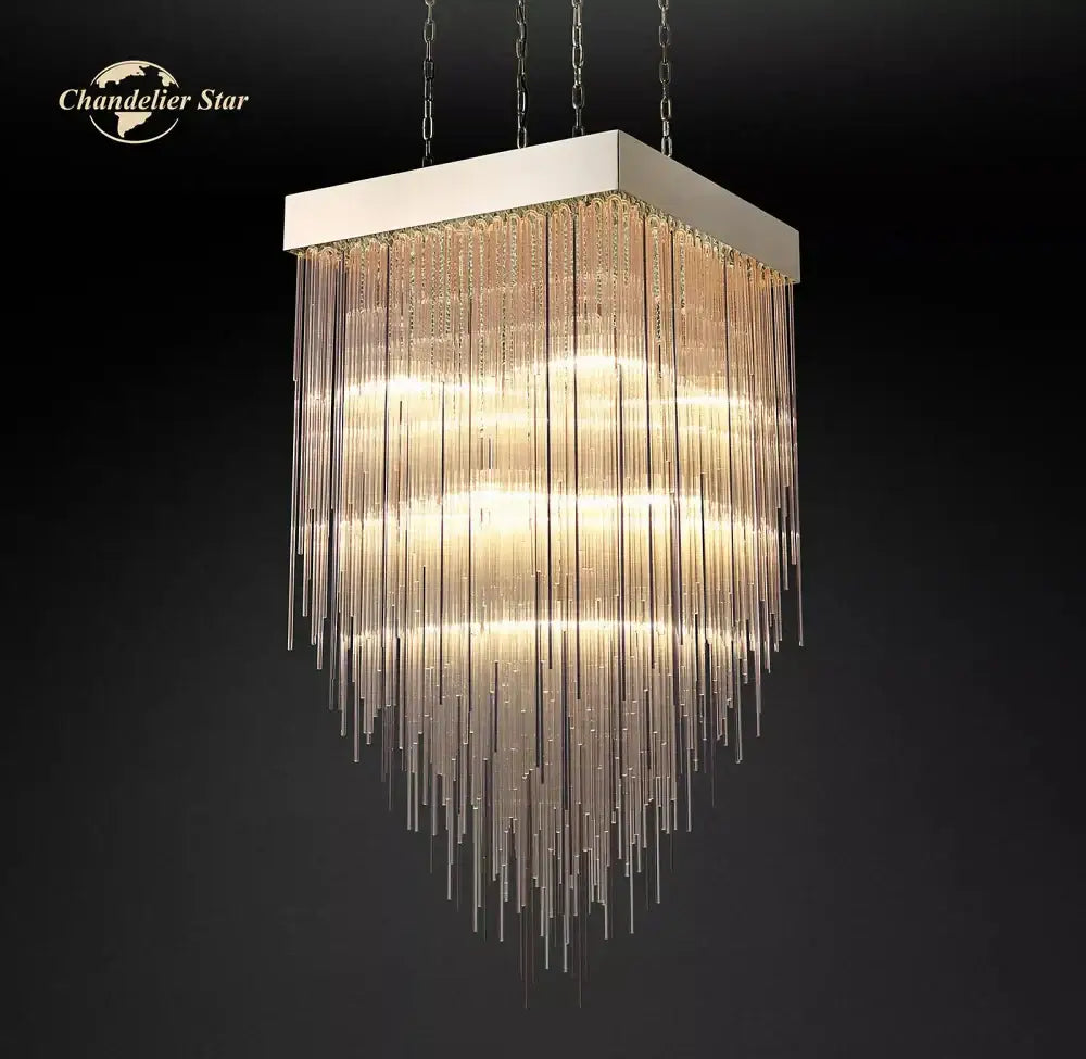 Modern cascada led glass chandelier with white metal frame and cascading glass rods creating warm golden glow for dining room