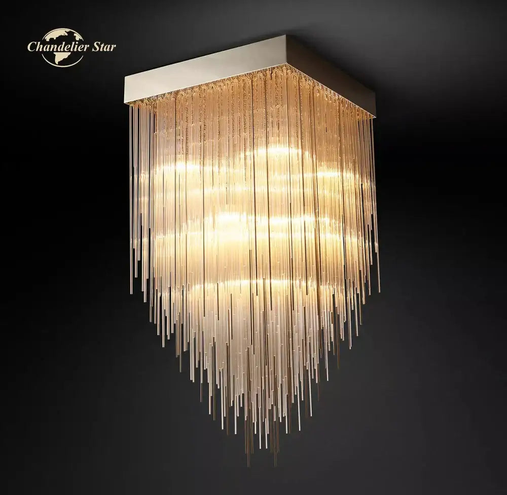 Modern cascada led glass chandelier gold square dining room light with cascading golden glass rods and sleek metallic frame