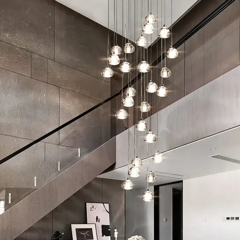 Modern cascading decorbites crystal ball chandelier with sleek glass globe design for elegant living room lighting