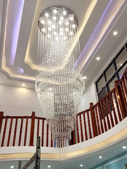 A modern cascading decorbites crystal chandelier with clear glass beads and embedded lights for living room use