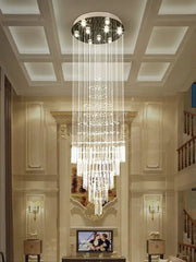 A modern multi-tiered decorbites crystal chandelier with clear glass prisms for living room decor