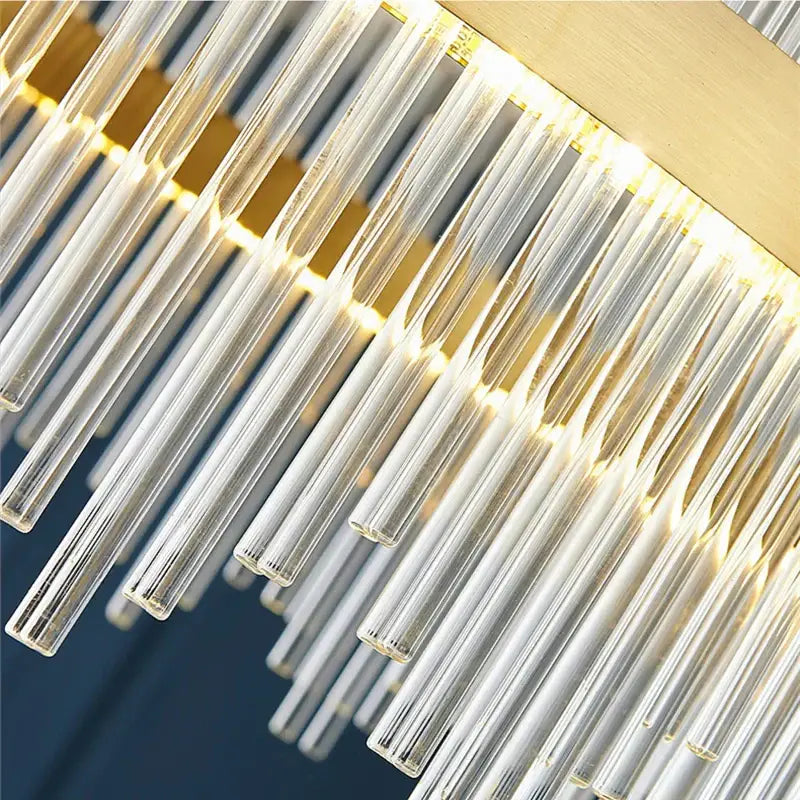 Modern cascading gold crystal pendant chandelier with clear glass prisms and gold-toned metal accents for dining room decorbites crystal pendant