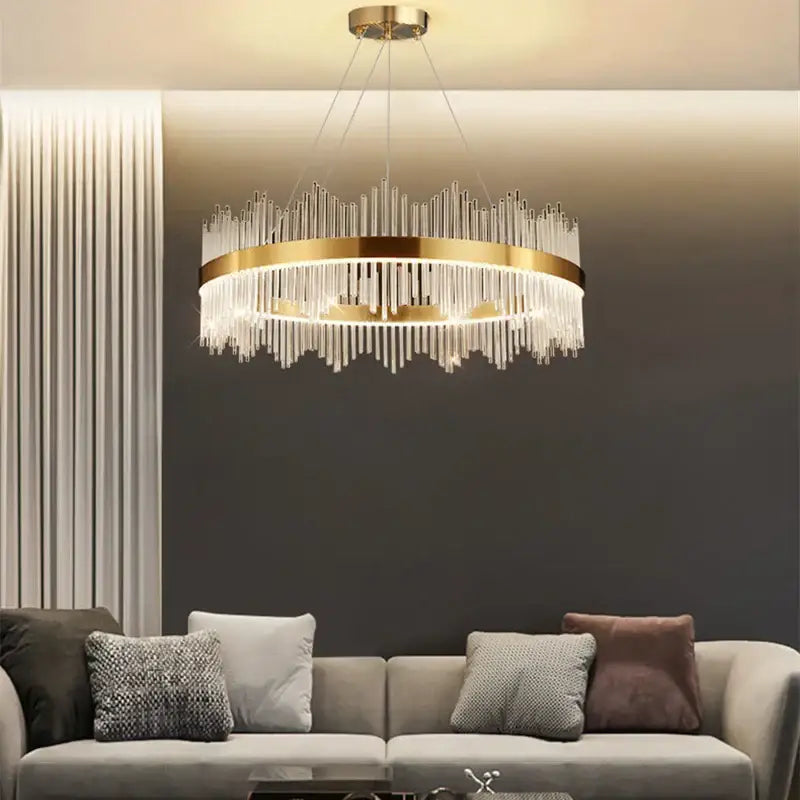 Modern cascading gold crystal pendant chandelier with a circular metal frame and clear crystal prisms for dining room decorbites crystal pendant