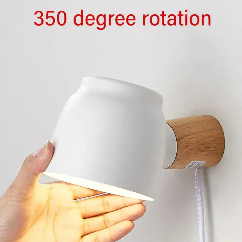 White ceramic and wood led wall lamp with 350-degree rotation ideal as a bedroom reading light source
