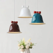 Modern ceramic bowknot bell led lighting fixture with glossy white teal and brown finishes and red bows for dining room decorbites bowknot bell