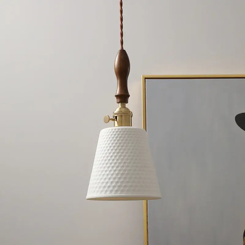 Modern ceramic led pendant light in off-white with a textured finish and dark wood handle for dining room decorbites ceramic led
