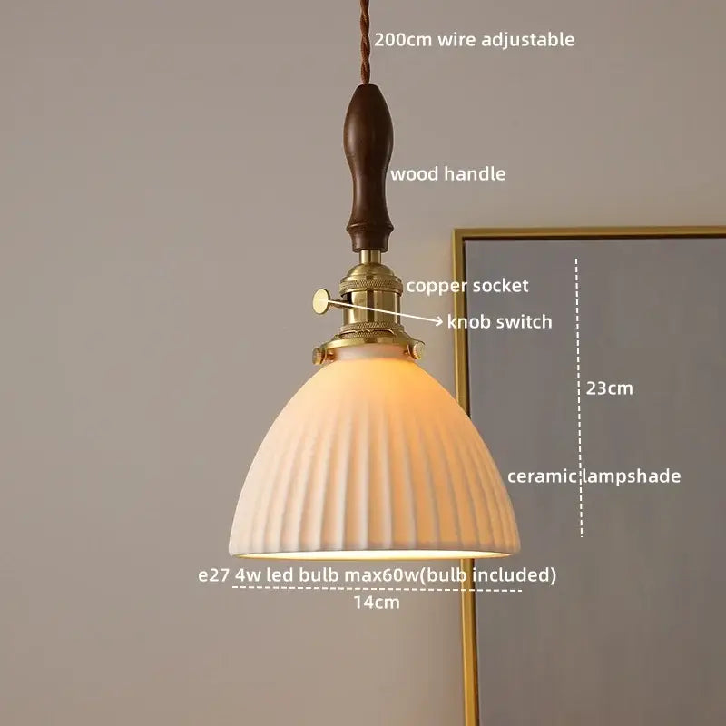 A warm-toned off-white ceramic led pendant light with vertical ridges wood handle and brass hardware for dining room decorbites ceramic led