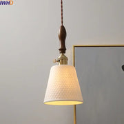 Modern ceramic led pendant light with off-white textured fabric shade, brass hardware, and dark wood handle for dining room decorbites ceramic led pendant