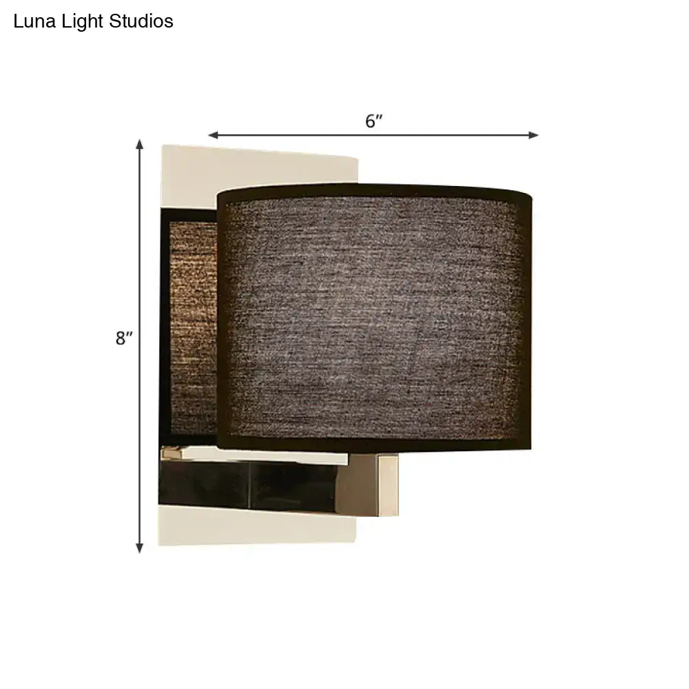 Modern charcoal fabric drum wall sconce with textured dark gray shade and sleek metallic base in white black design