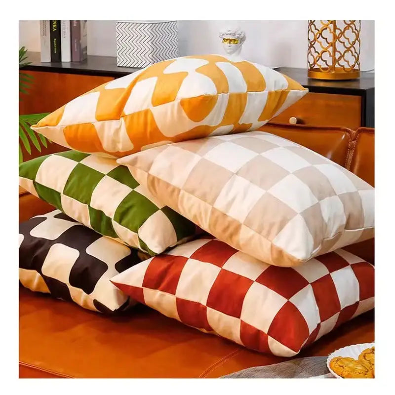 Stacked modern checkered fluffy velvet cushion covers in orange white green cream black off-white and red ivory decorbites fluffy velvet pillow