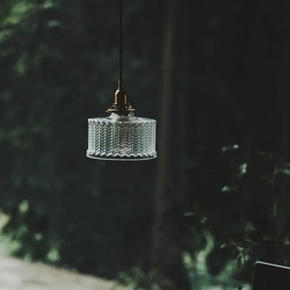 Modern chevron clear glass led pendant light with textured ribbed design and brass hardware by decorbites pendant light