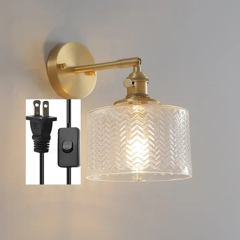 Gold-finished wall light with green glass led clear shade embossed with chevron pattern and pull chain switch