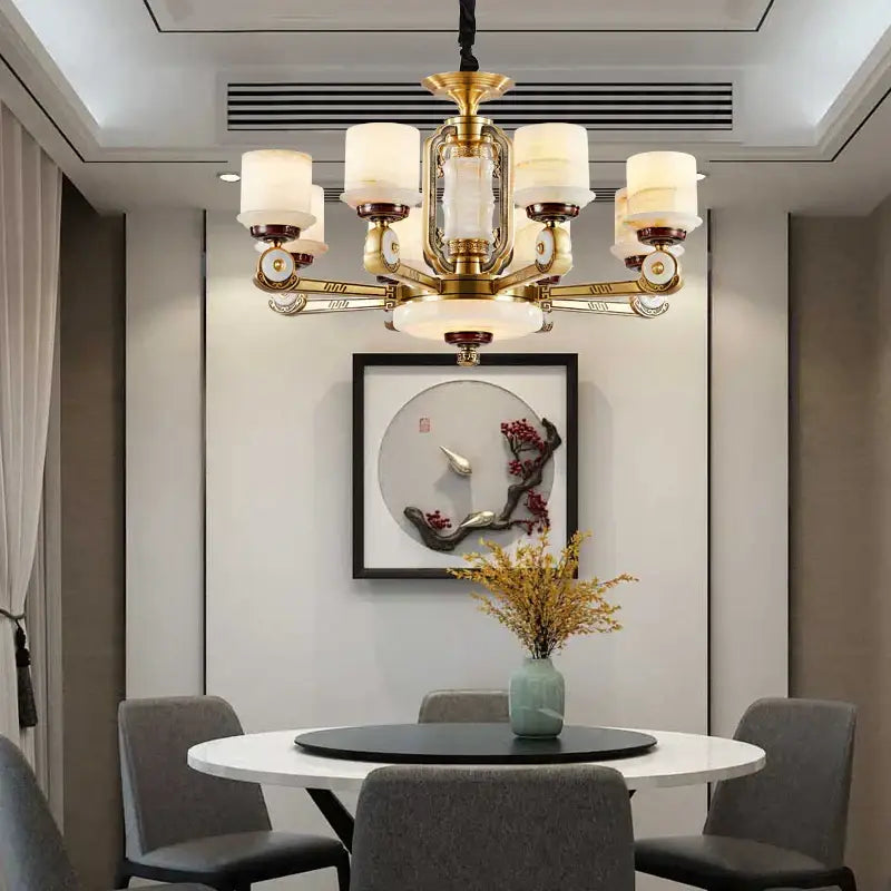 Modern chinese gold copper jade chandelier with brass ornate detailing and frosted glass shades for living room use