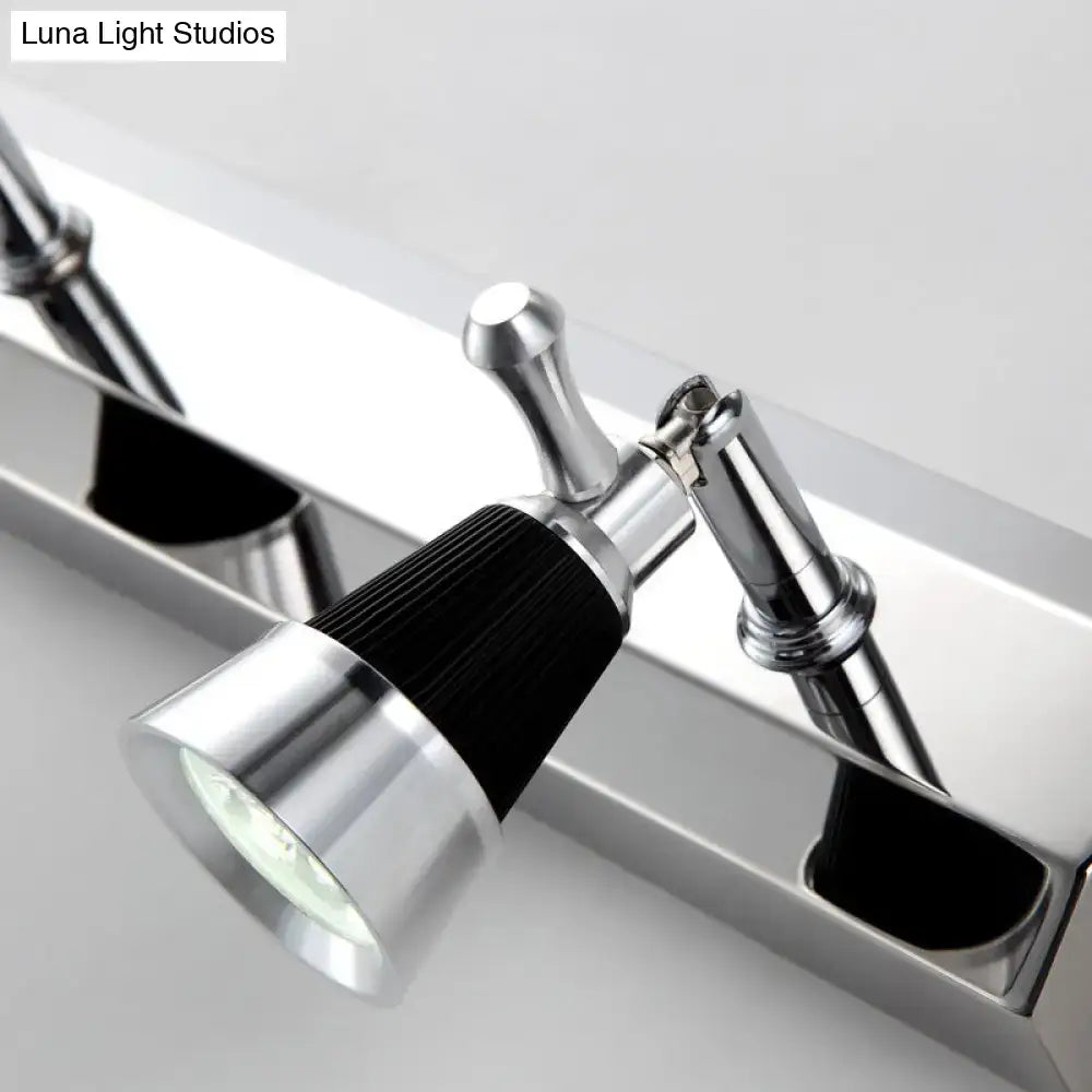 Modern chrome adjustable wall lamp with black ribbed accent band and clear lens spotlight for bathroom use