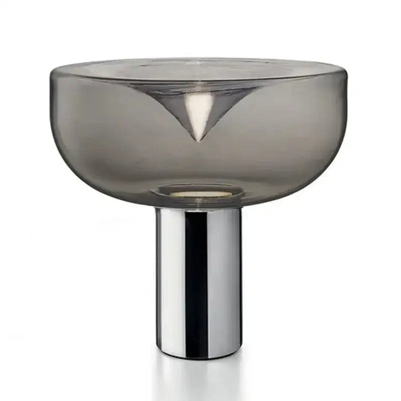 A sleek translucent gray glass table lamp with polished chrome base for modern bedroom decorbites aella glass table