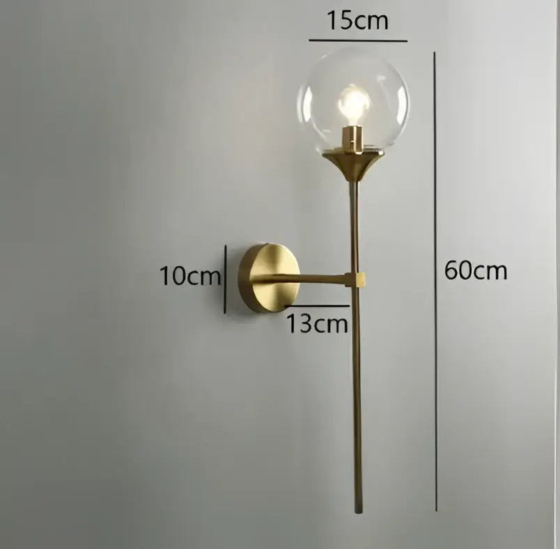 Modern chrome and amber glass ball wall lamp featuring brass-finished wall sconce with clear glass ball bulb for decorbites lighting