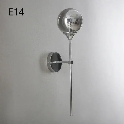 Modern chrome and amber glass ball wall lamps featuring a chrome-finished spherical globe for stylish living room lighting decorbites glass ball