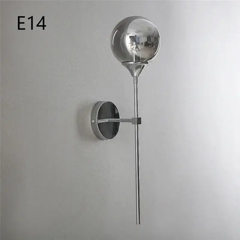 Modern chrome and amber glass ball wall lamps featuring a chrome-finished spherical globe for stylish living room lighting decorbites glass ball