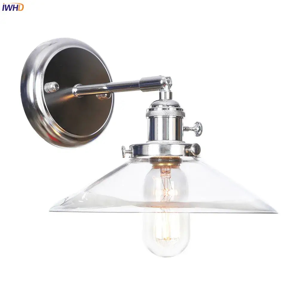 Modern chrome wall light with amber glass ball shade and exposed edison bulb for bedroom sconce lighting