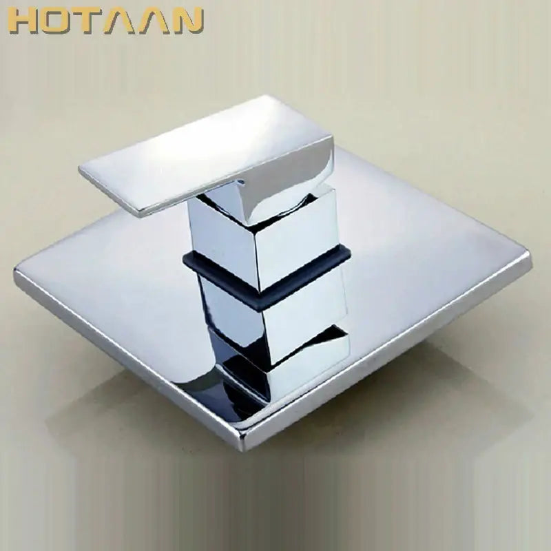 Modern chrome and black square shower mixer valve with a sleek geometric design and black accent band