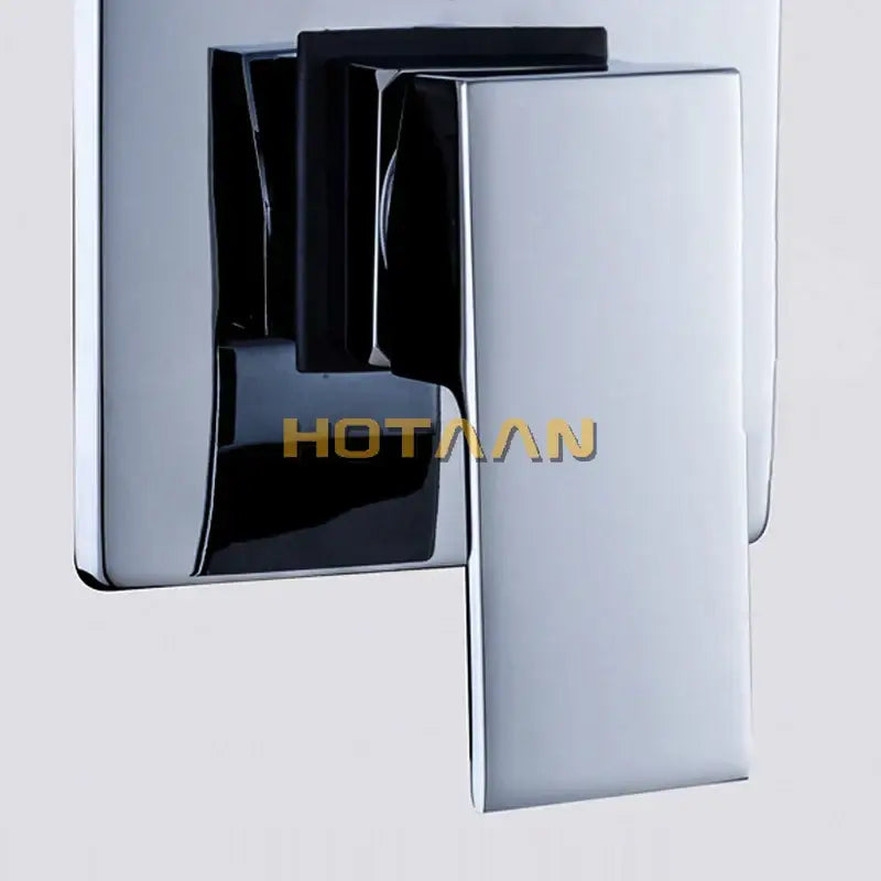 Modern chrome and black square shower mixer valve with sleek rectangular design and chrome-finished wall-mounted faucet