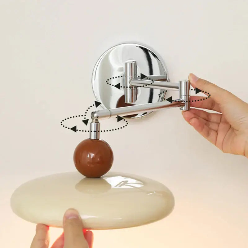 Modern chrome and ceramic iron wall light with adjustable wall-mounted vanity mirror and brown spherical knob decorbites iron wall light