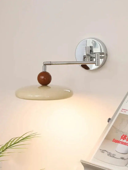 Modern chrome and ceramic iron wall light with cream ceramic shade and warm brown accent for bedroom decorbites iron wall light