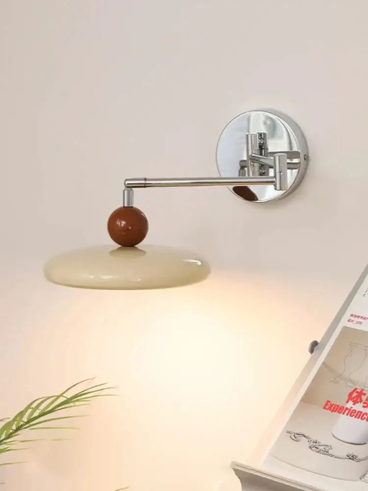 Modern chrome and ceramic iron wall light with cream ceramic shade and warm brown accent for bedroom decorbites iron wall light