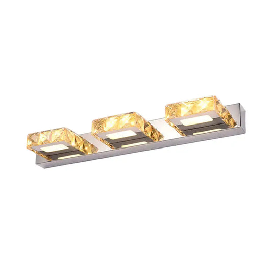Modern chrome and gold crystal vanity sconce with three-light polished chrome frame and faceted crystal accents