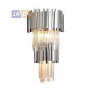 Modern chrome and gold decorbites crystal clear led wall sconce with a sleek tiered design for bedroom lighting