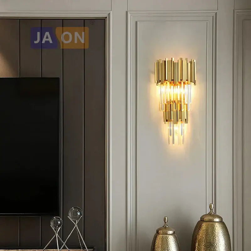 Modern chrome and gold decorbites crystal clear led wall sconce with gold-toned vertical brass rods and clear crystal accents