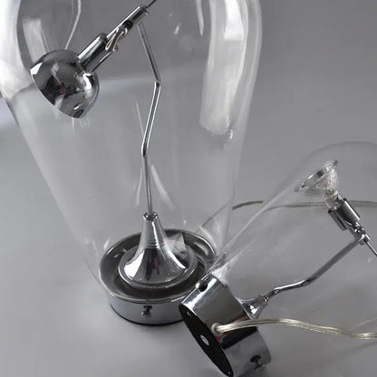 Modern chrome and transparent blow glass table lamp with articulated arm by decorbites lodes blow for living room decor