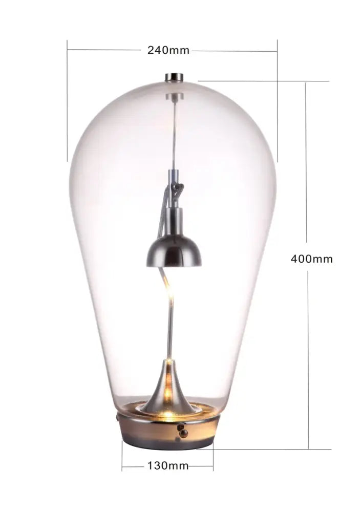 A modern chrome and transparent lodes blow glass table lamp with teardrop design for elegant living room decorbites lodes blow