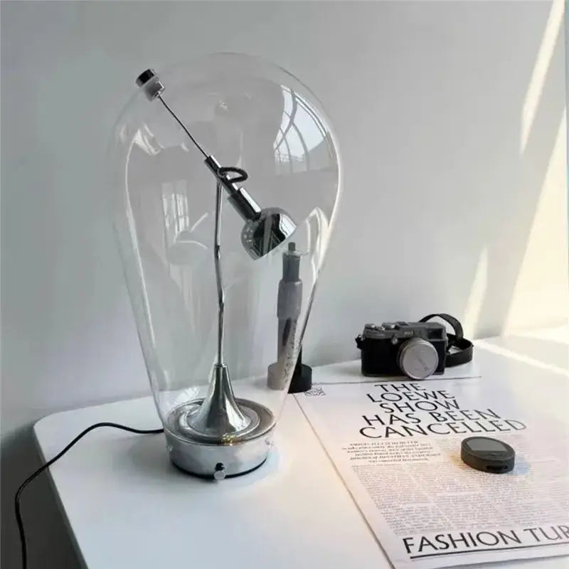 Modern chrome and transparent blow glass table lamp with chrome finish adjustable arm for living room decorbites lodes blow